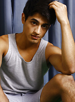 Good-looking twink posing at the studio