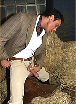Marcello dressed in full riding suit masturbating in the stables
