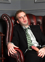 Horny gay guy in a suit wanking his cock
