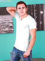 Uncut Philip Razul blasts cum onto his stomach.